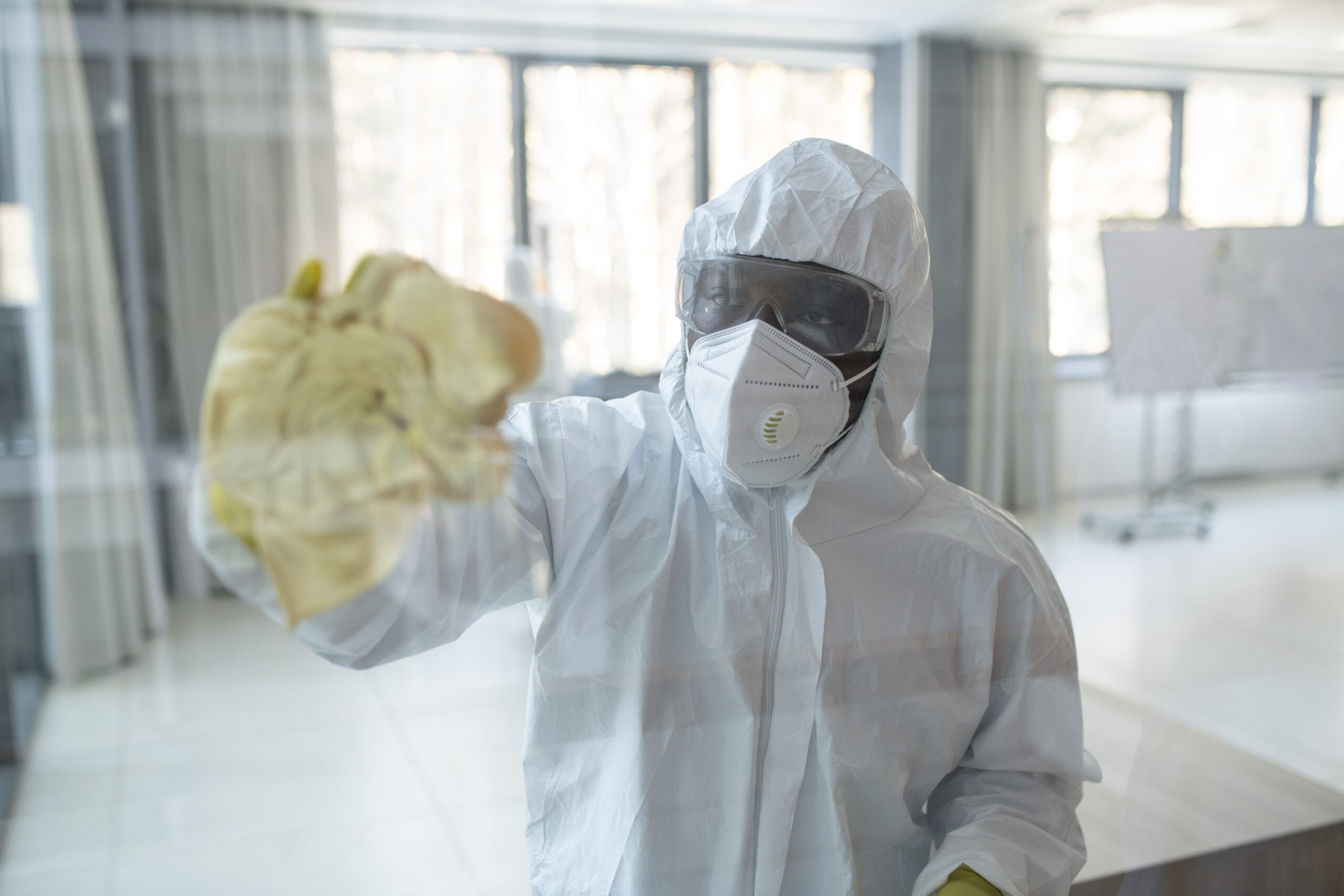 medium-shot-man-hazmat-suit-cleaning medium-shot-man-hazmat-suit-cleaning